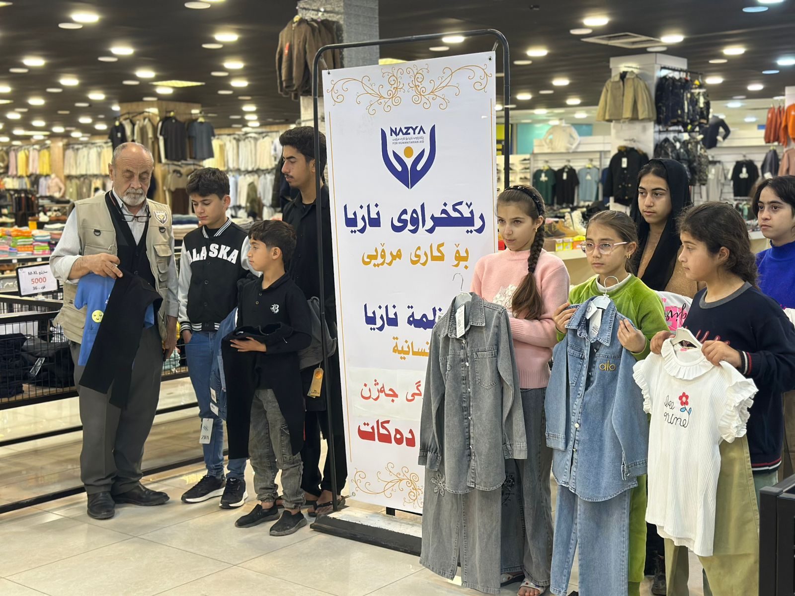 Nazya Humanitarian Aid distributing Eid clothes and gifts to children and families in need in Kurdistan