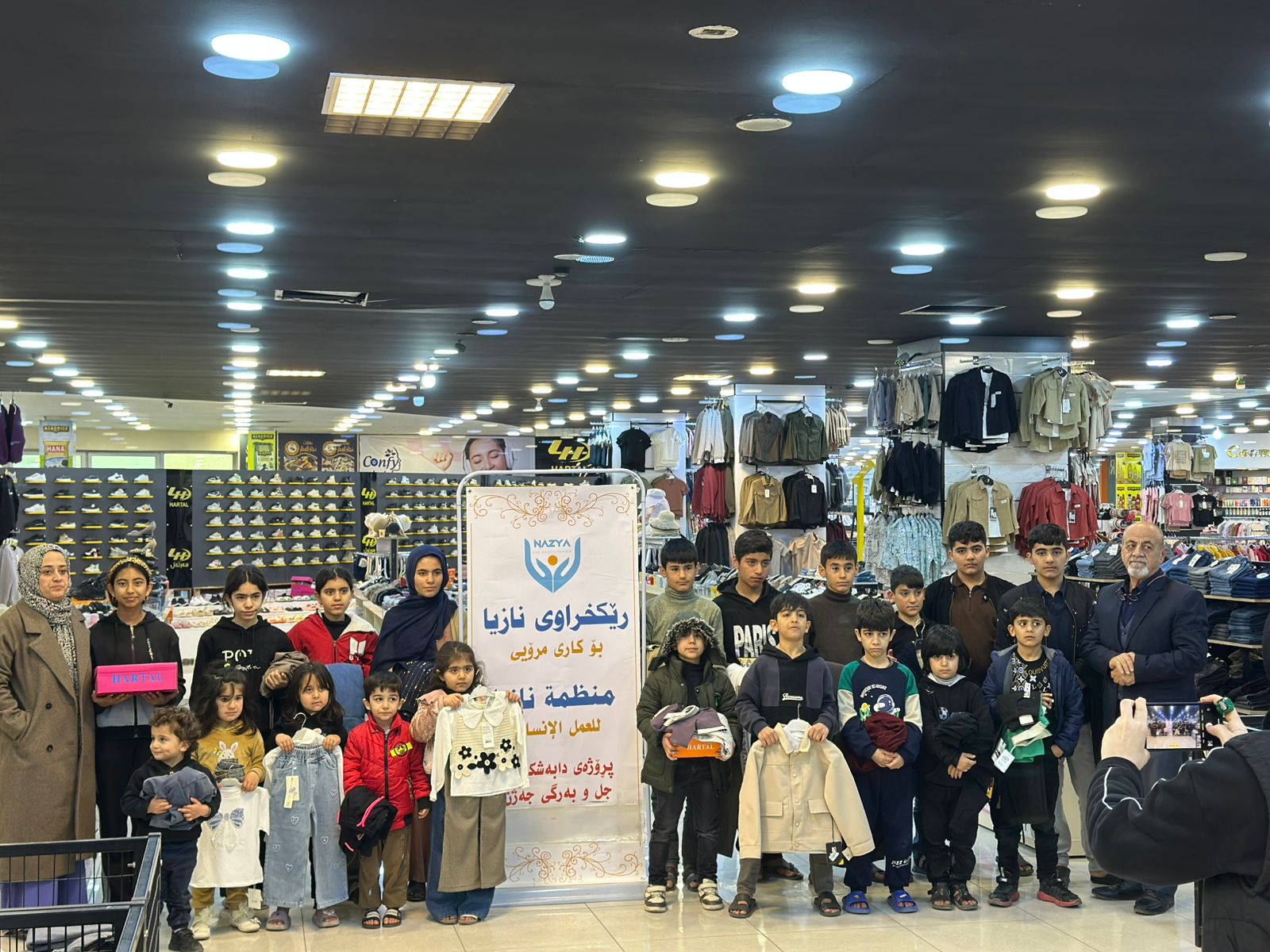 Nazya Humanitarian Aid distributing Eid clothes and gifts to children and families in need in Kurdistan