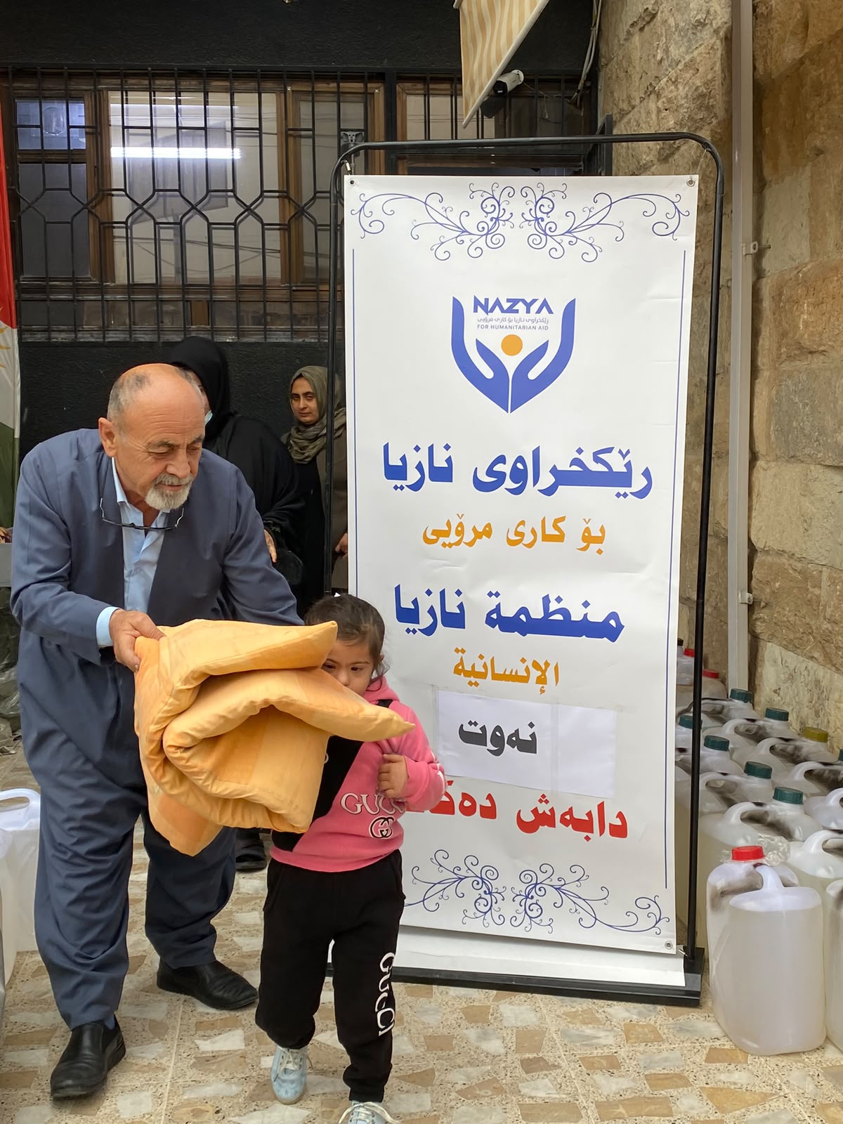 Nazya Humanitarian Aid distributing heating oil (kerosene) to families for heaters (zopa) during winter in Kurdistan