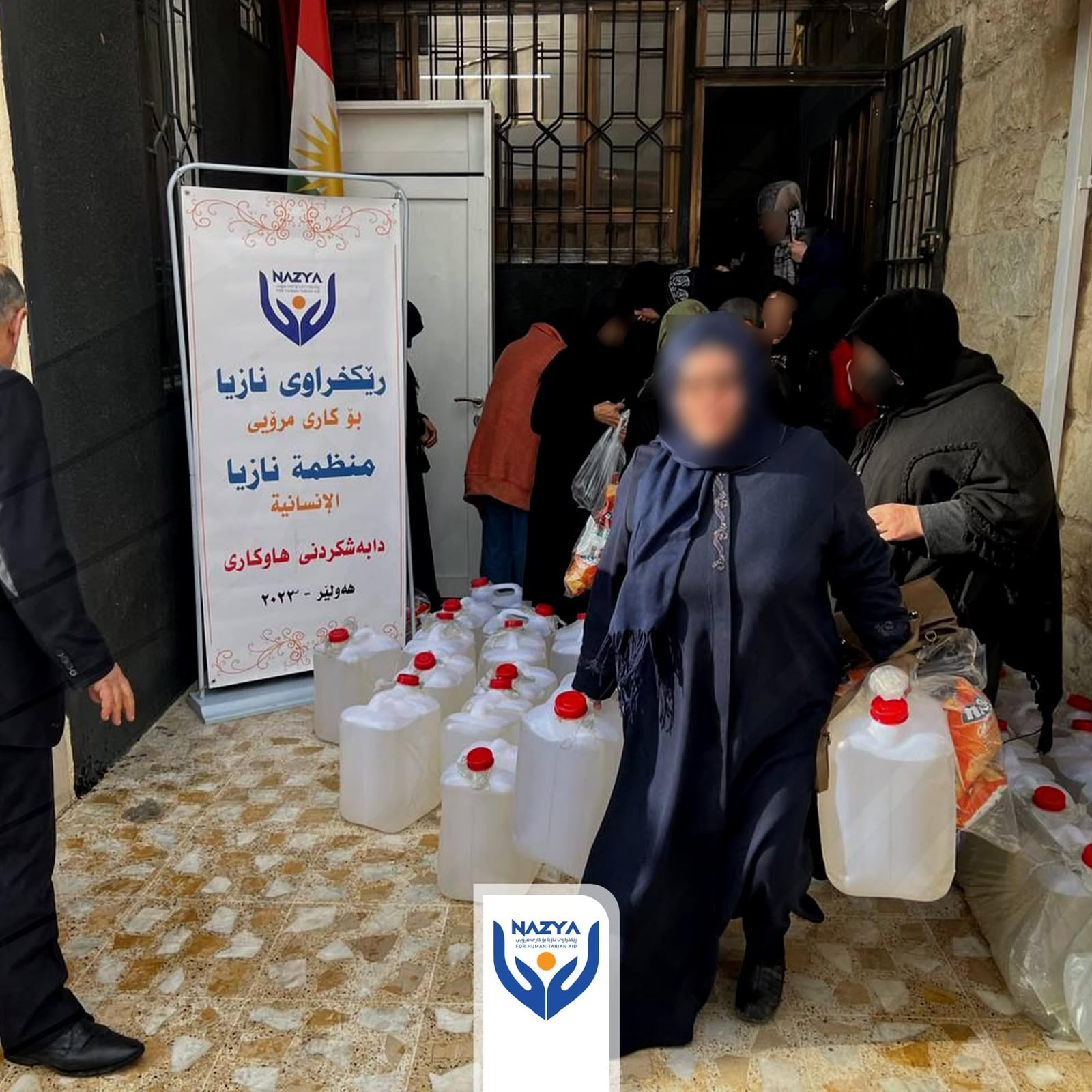 Nazya Humanitarian Aid distributing heating oil (kerosene) to families for heaters (zopa) during winter in Kurdistan