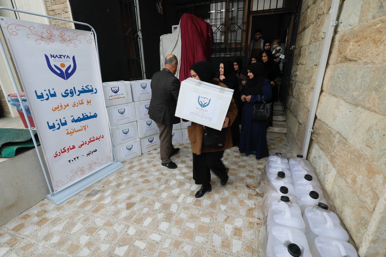 Nazya Humanitarian Aid distributing heating oil (kerosene) to families for heaters (zopa) during winter in Kurdistan