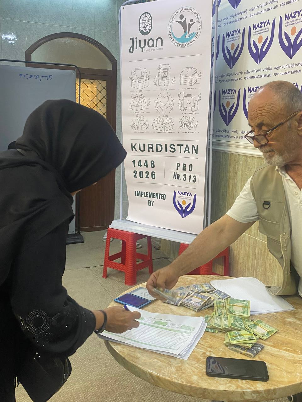 Nazya Humanitarian Aid providing monthly salary support and financial aid to vulnerable families living in poverty in Kurdistan Region