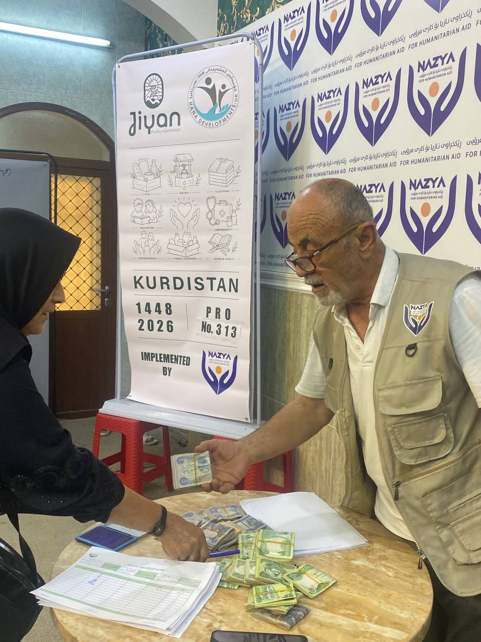 Nazya Humanitarian Aid providing monthly salary support and financial aid to vulnerable families living in poverty in Kurdistan Region